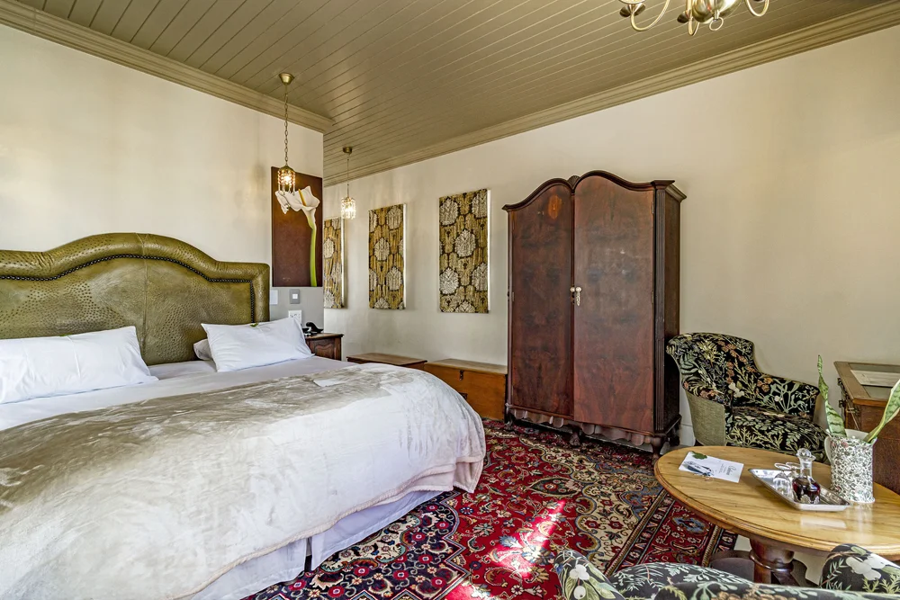 _MG_0005 Double bed with an upholstered headboard and antique wardrobe