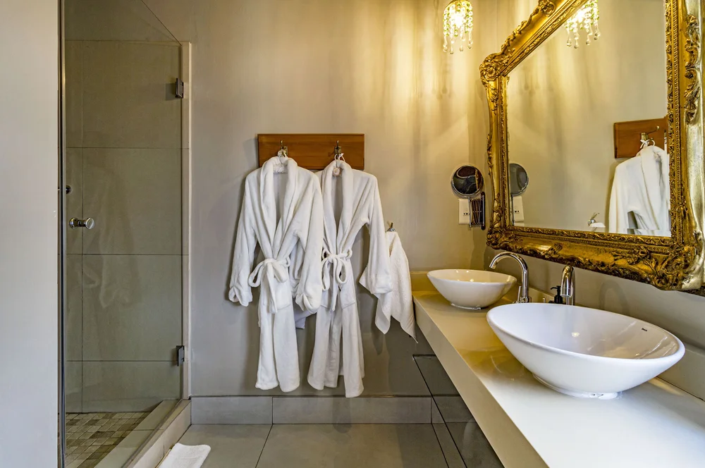 _MG_0011 Bathrobes, twin vessel basins and a glass shower