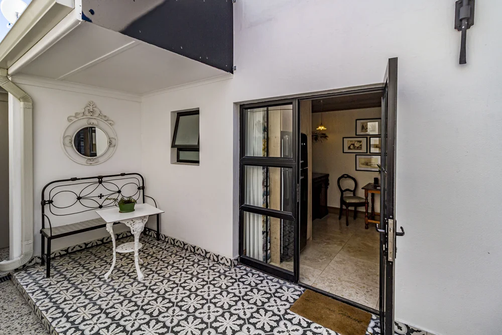 _MG_9883 Standard Apartment entrance with a wrought-iron bench and patterned floor tiles