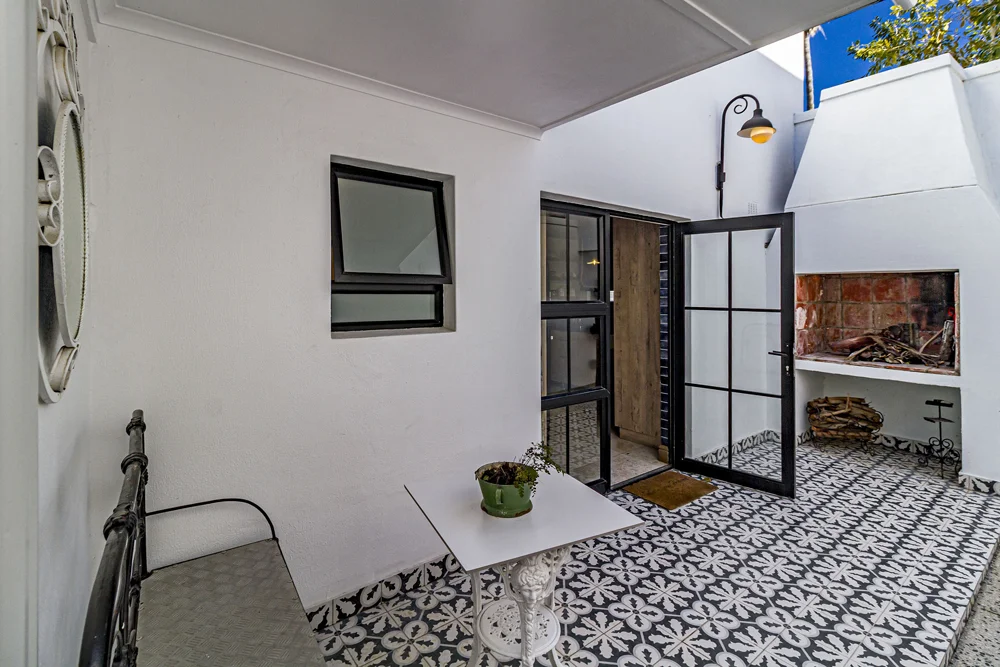 _MG_9886 Private courtyard with patterned tiles and a brick fireplace