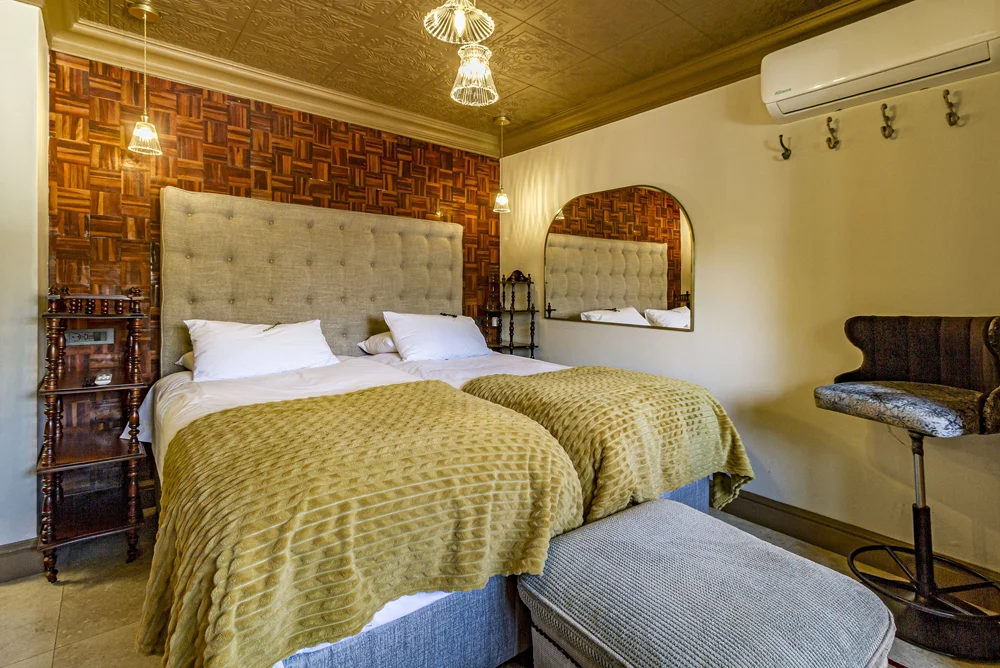 _MG_9899 Standard Apartment bedroom with twin beds and mustard throws