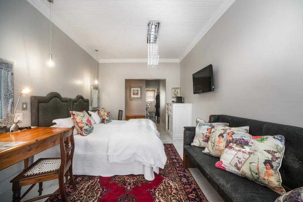 peartree_batavia-46 Luxury Twin Room with a sofa, floral cushions and desk