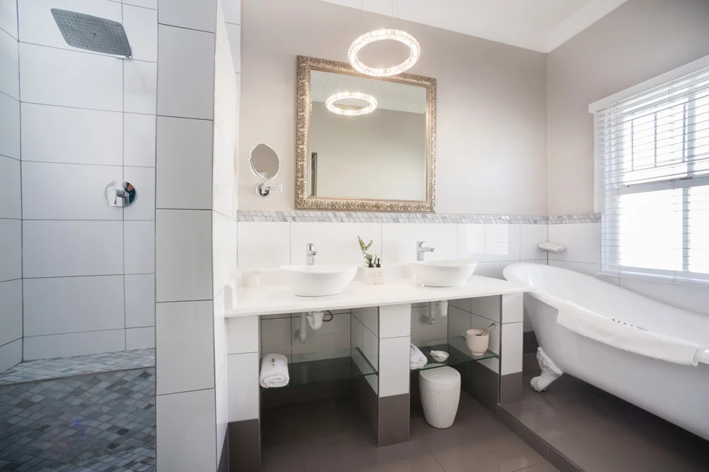 peartree_batavia-48 White bathroom with a double basin and freestanding bath