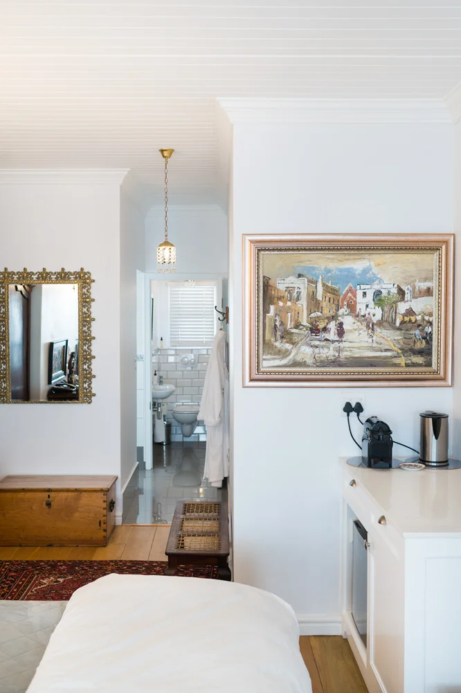 peartree_batavia-59 Framed street-scene painting beside a gilt mirror